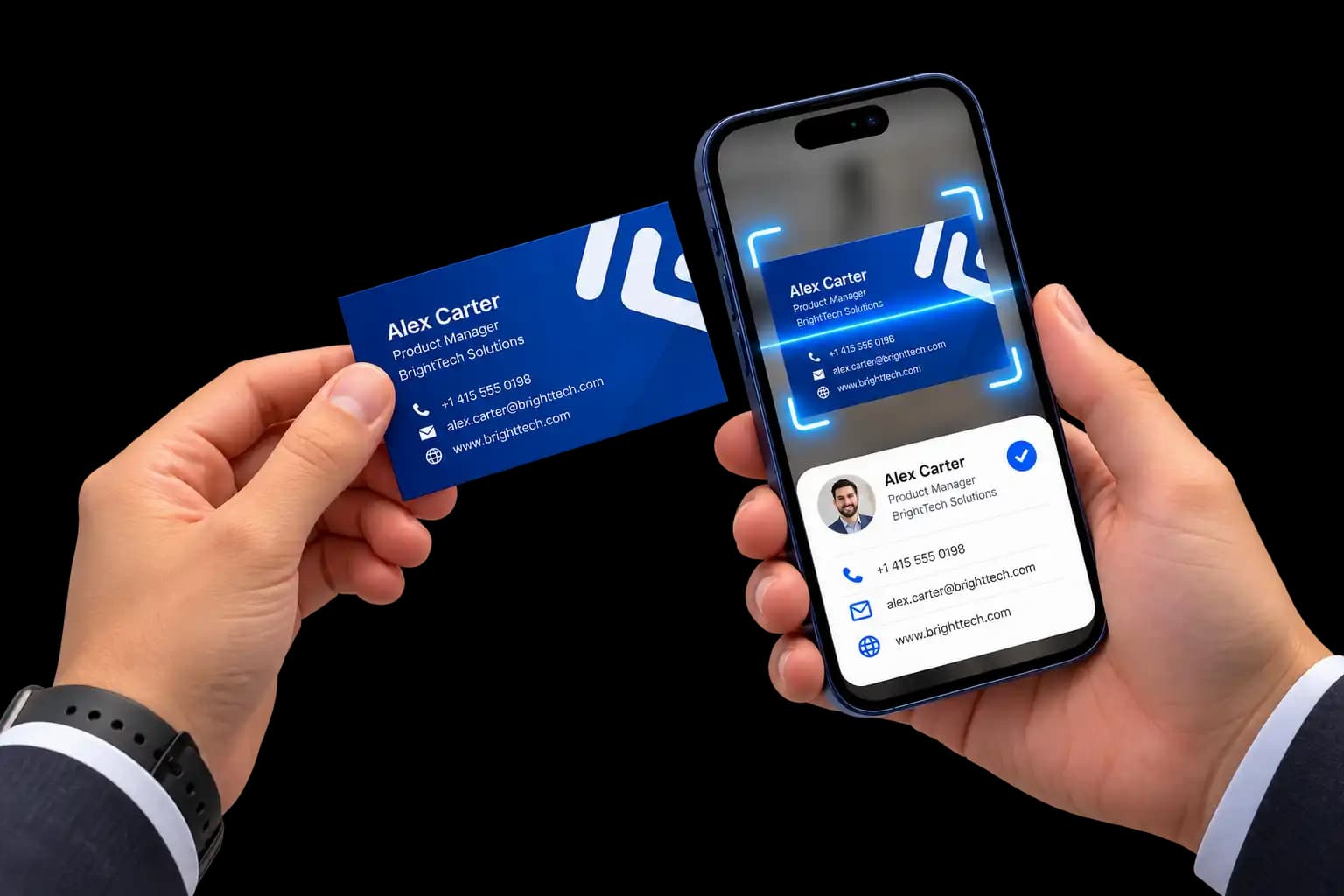 A hand holding a paper business card in front of a phone that outlines the card and shows the contact it read: name, role, company, phone, email and website
